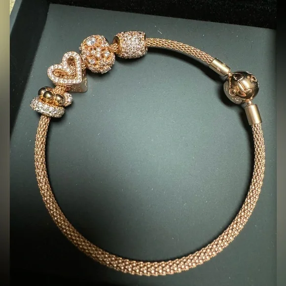 Authentic rose Pandora bracelet and beads